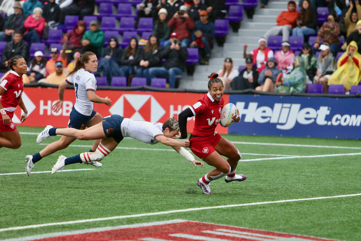 Canada’s Keyara Wardley smiles as she shrugs off a tackle by Spain during the HSBC World Rugby Sevens Series stop at Starlight Stadium on April 30. (Justin Samanski-Langille/News Staff)