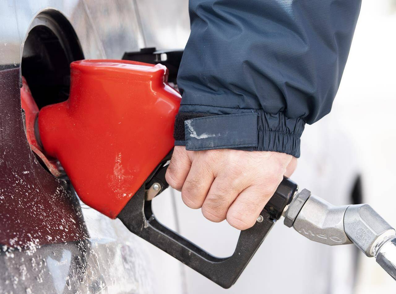 A man pumps gas in Montreal, Friday, March 4, 2022. Statistics Canada will release consumer price index data for June on Wednesday, a week after the Bank of Canada raised its key interest rate by a full percentage point as it continues its battle against high inflation.THE CANADIAN PRESS/Graham Hughes