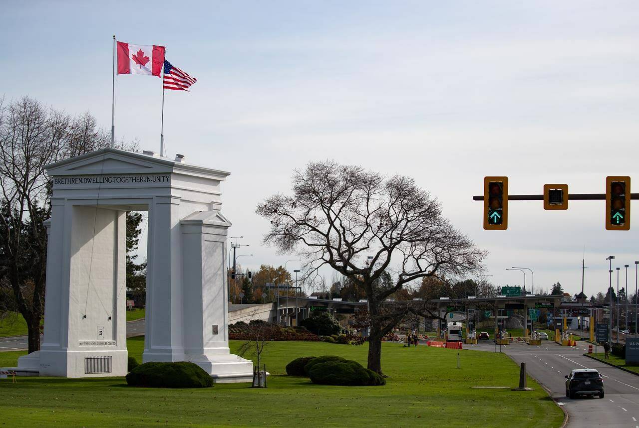 Motorists wait at U.S. Customs and Border Protection inspection booths at the Peace Arch border crossing in Blaine, Wash., across the Canada-U.S. border from Surrey, B.C., on Monday, November 8, 2021. Amid ongoing cultural and social upheaval in the U.S., more Americans are seriously considering a move north of the border. THE CANADIAN PRESS/Darryl Dyck