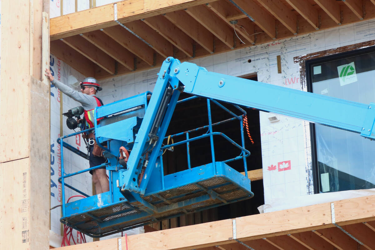 A worker toils on a construction project on Orono Avenue in Langford. Council will vote July 18 on whether to charge a fee for applications for construction noise bylaw exemptions. (Bailey Moreton/News Staff)