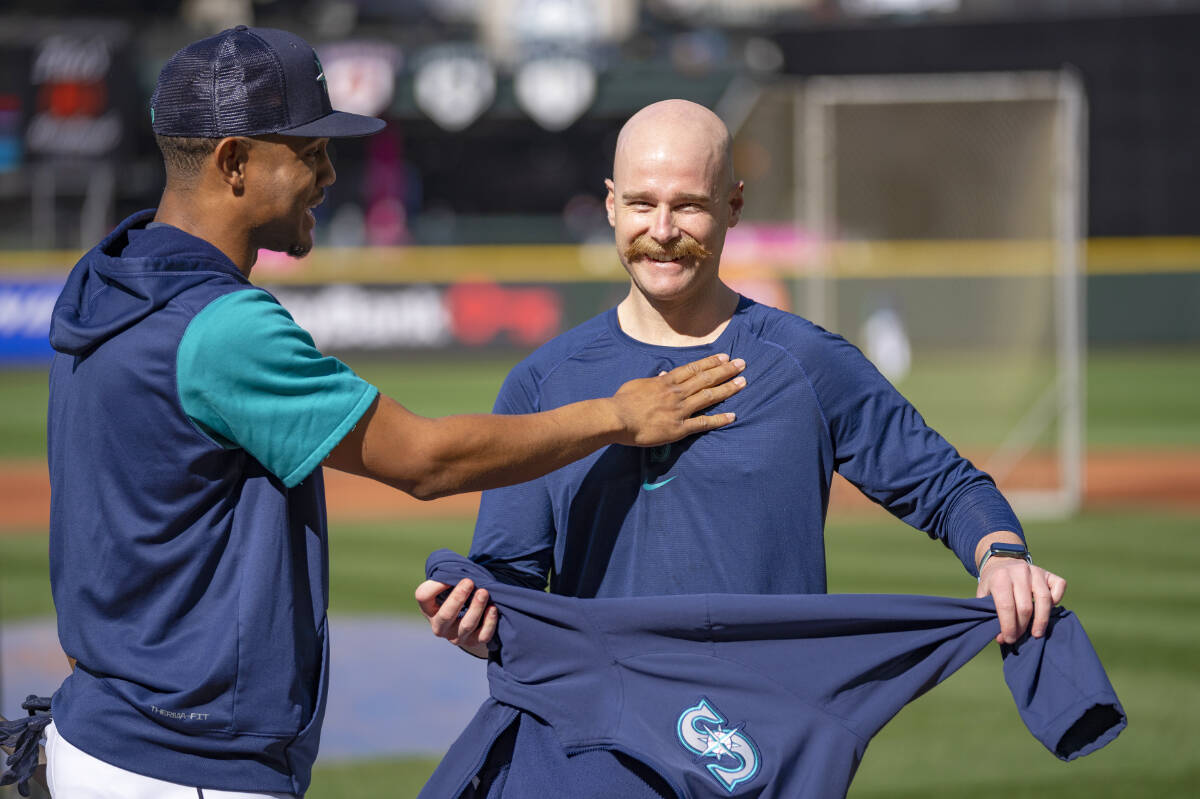 Seattle Mariners field co-ordinator and former Saanich resident Carson Vitale, right, shares a laugh with the team’s rookie star Julio Rodriguez at T-Mobile Park. (Photo by Ben VanHouten/Seattle Mariners)