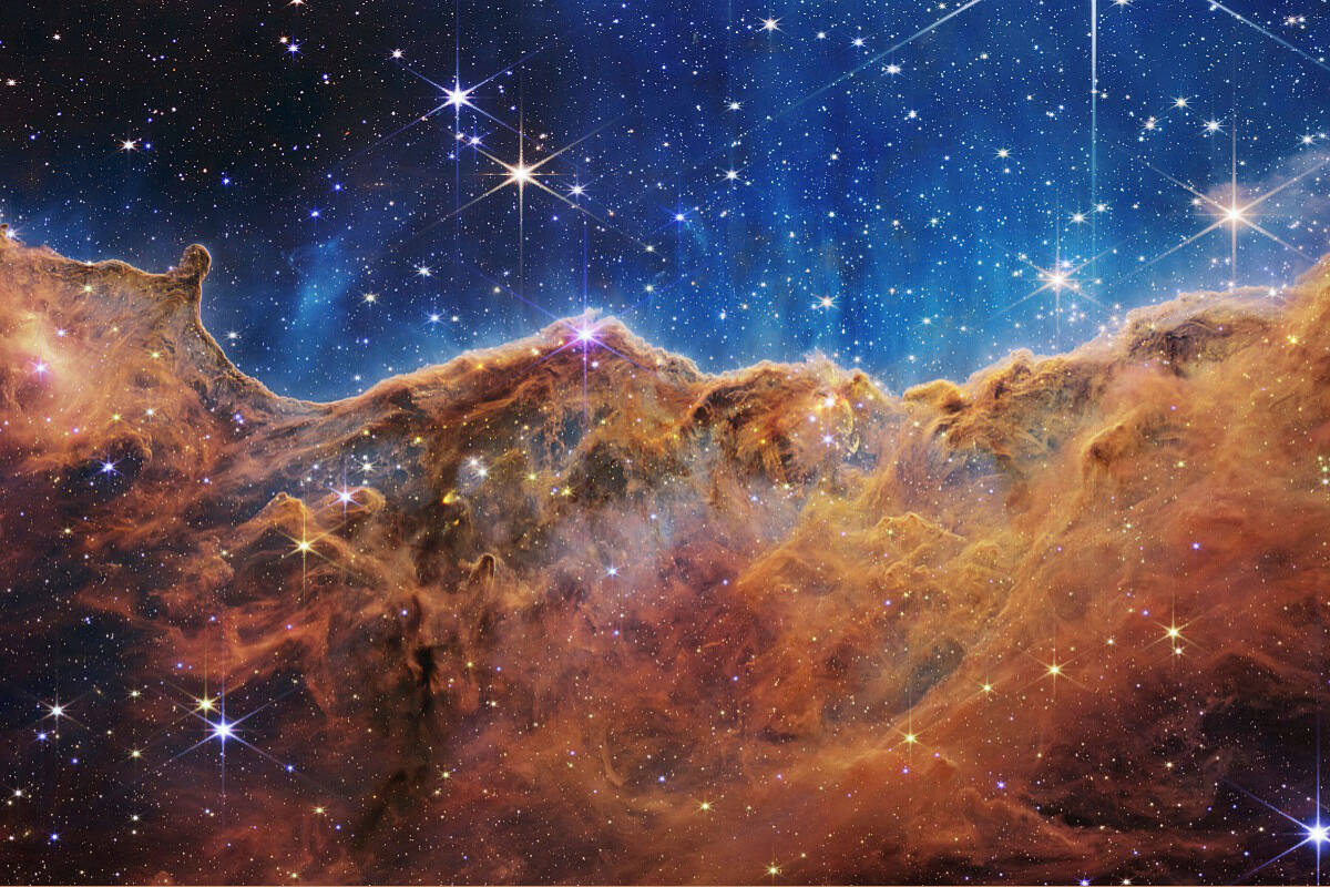This image released by NASA on Tuesday, July 12, 2022, shows the edge of a nearby, young, star-forming region. The conference on Aug 15-19 could have a huge impact on our understanding of space and time. (NASA, ESA, CSA, and STScI via AP) (NASA, ESA, CSA, and STScI via AP)