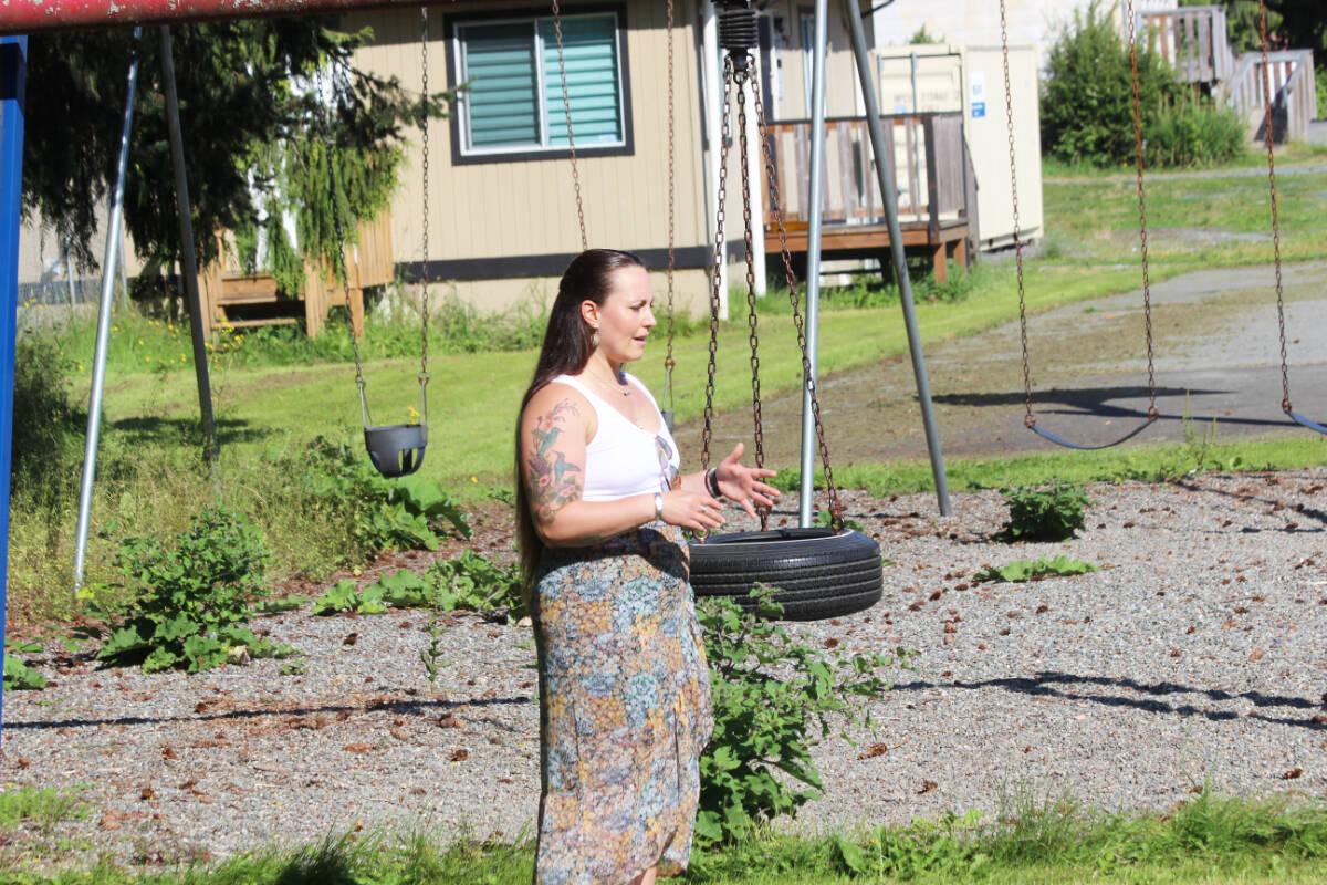 Christine Thomas addresses the crowd, with the old playground in the background. (Photo by Don Bodger)