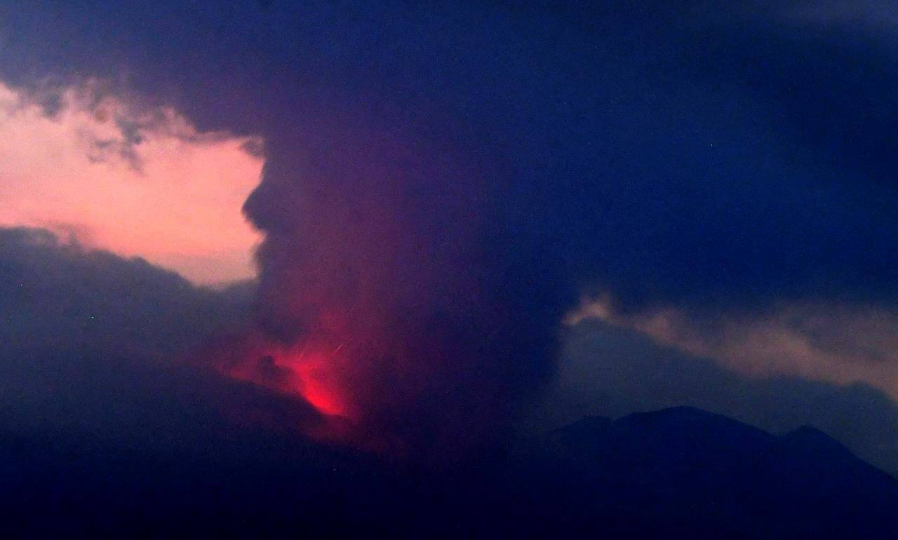 This long exposure image shows the eruption of volcano Sakurajima Sunday night, July 24, 2022, in the view from Tarumizu city, Japan’s southern prefecture of Kagoshima. Japan’s Meteorological Agency said a volcano on Japan’s southern main island of Kyushu erupted Sunday night, spewing ash and volcanic rocks, but there were no immediate reports of damage or injuries in nearby towns. (Kyodo News via AP)