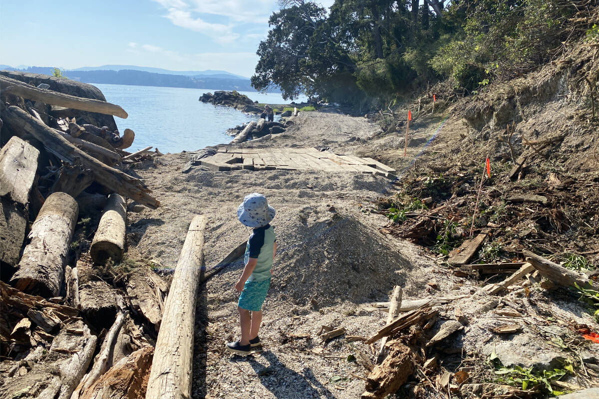 A temporary access road and construction stakes rim what has been a popular North Saanich beach, off Madrona Drive and Norris Road. A retaining wall project underway at the rear of a Madrona Drive property has made the beach much less desirable spot, residents say. (Photo by Dave Spencer)
