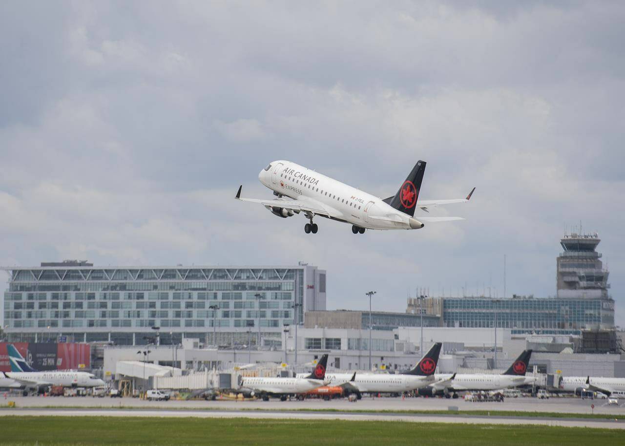 An Air Canada jet takes off from Trudeau Airport in Montreal, Thursday, June 30, 2022. THE CANADIAN PRESS/Graham Hughes