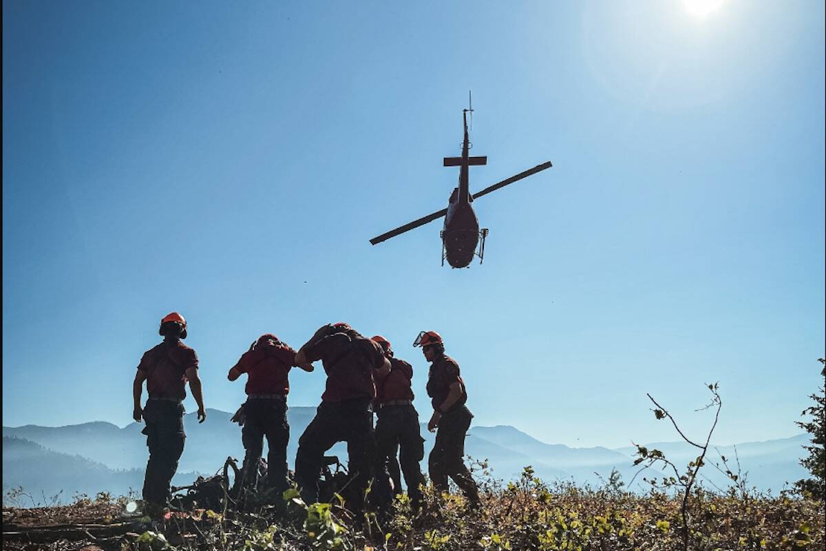 Dozens of firefighters and 11 helicopters continue to battle the Nohomin Creek blaze Aug. 2. (Courtesy of BC Wildfire Service)