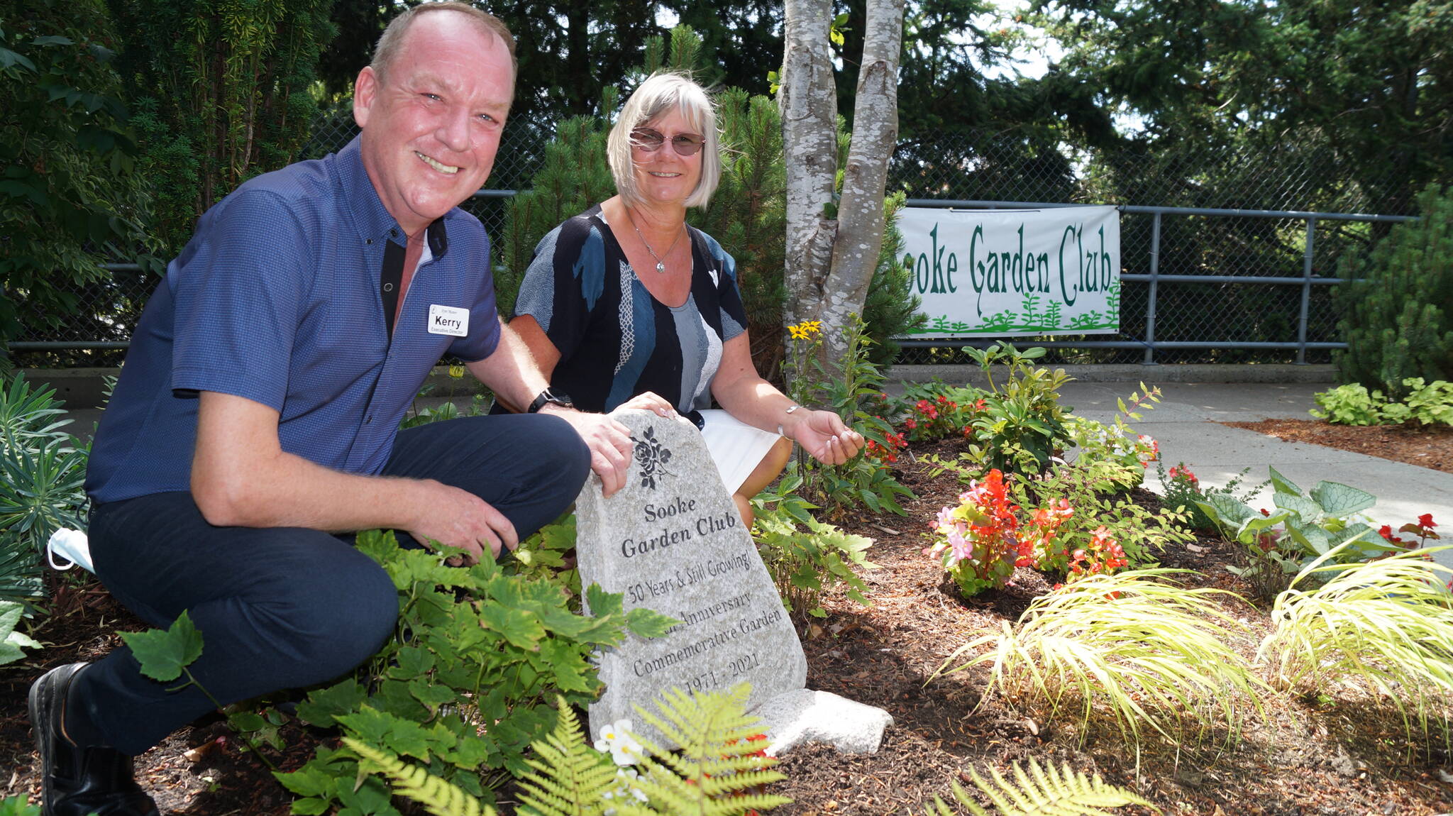 Ayre Manor executive director Kerry Williams and Sooke Garden Club president Lori Kirk with the commemorative stone monument marking the club’s 50th anniversary and the addition of a second garden for the residents to enjoy at Ayre Manor. (Rick Stiebel - Sooke News Mirror)