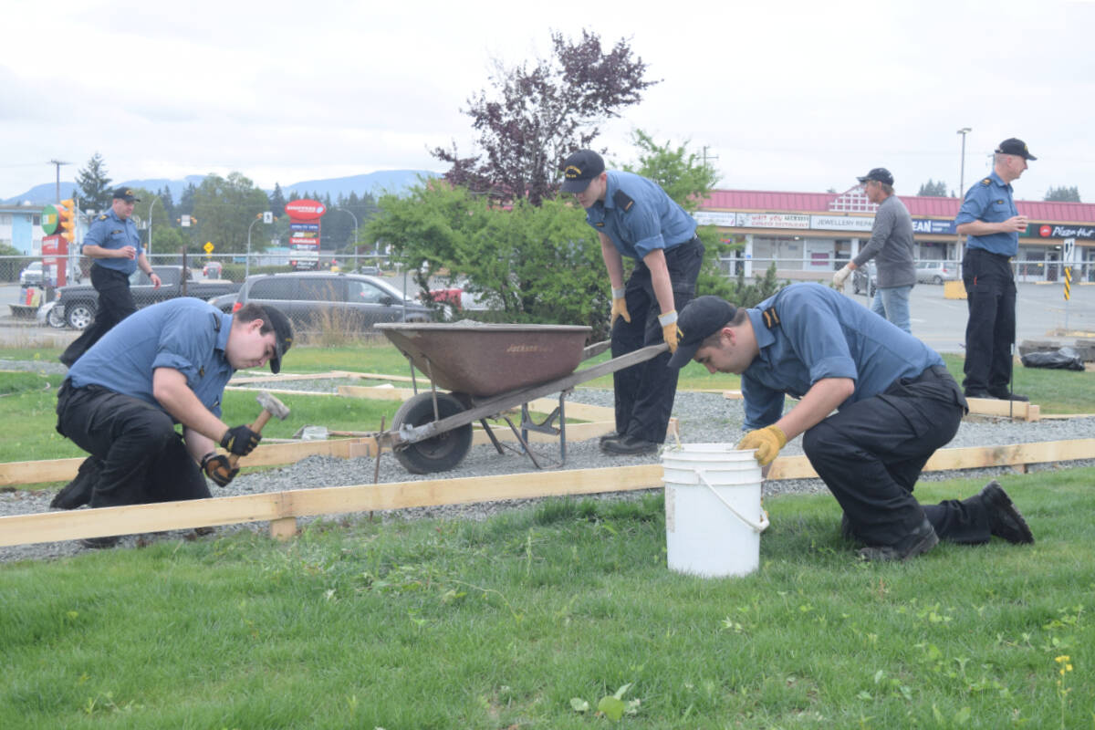 Representatives from the HMCS Ottawa do some volunteer work at the Redford Street Corner in Port Alberni. (ELENA RARDON / ALBERNI VALLEY NEWS)