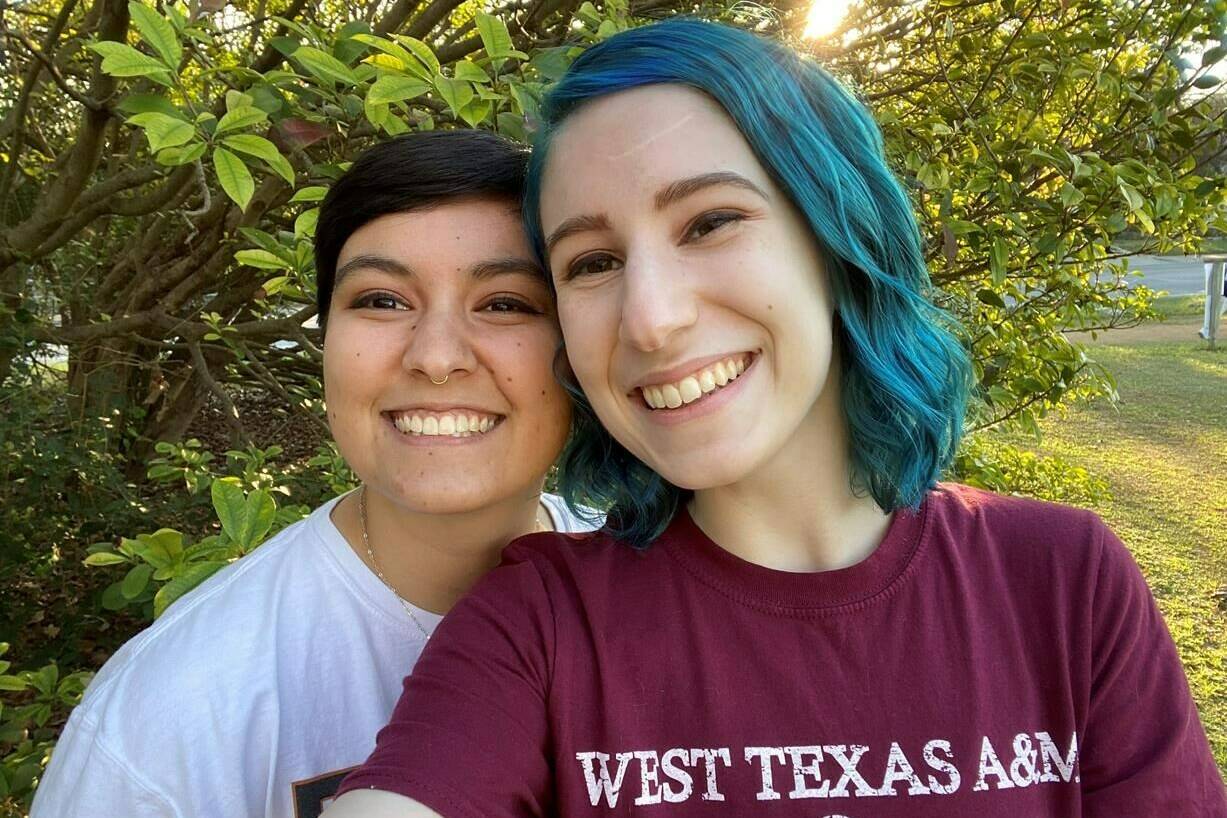 This Aug. 15, 2022, photo shows El Johnson, right, with her girlfriend, Sara Goodie, in Austin, Texas. Johnson has decided not to bear children, though she hasn’t ruled out adoption. The birth rate in the U.S. has dropped dramatically as more young people decide not to have children. (El Johnson via AP)
