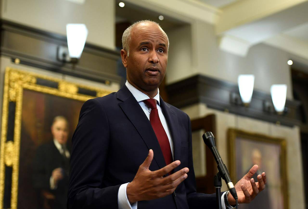 Minister of Housing and Diversity and Inclusion Ahmed Hussen speaks during a news conference in the foyer of the House of Commons in Ottawa on June 6, 2022. He cut $133,000 in government funding to the Community Media Advocacy Centre last week and suspended an anti-racism project it was overseeing after “reprehensible and vile” tweets posted by its senior consultant, Laith Marouf, came to light. THE CANADIAN PRESS/Justin Tang