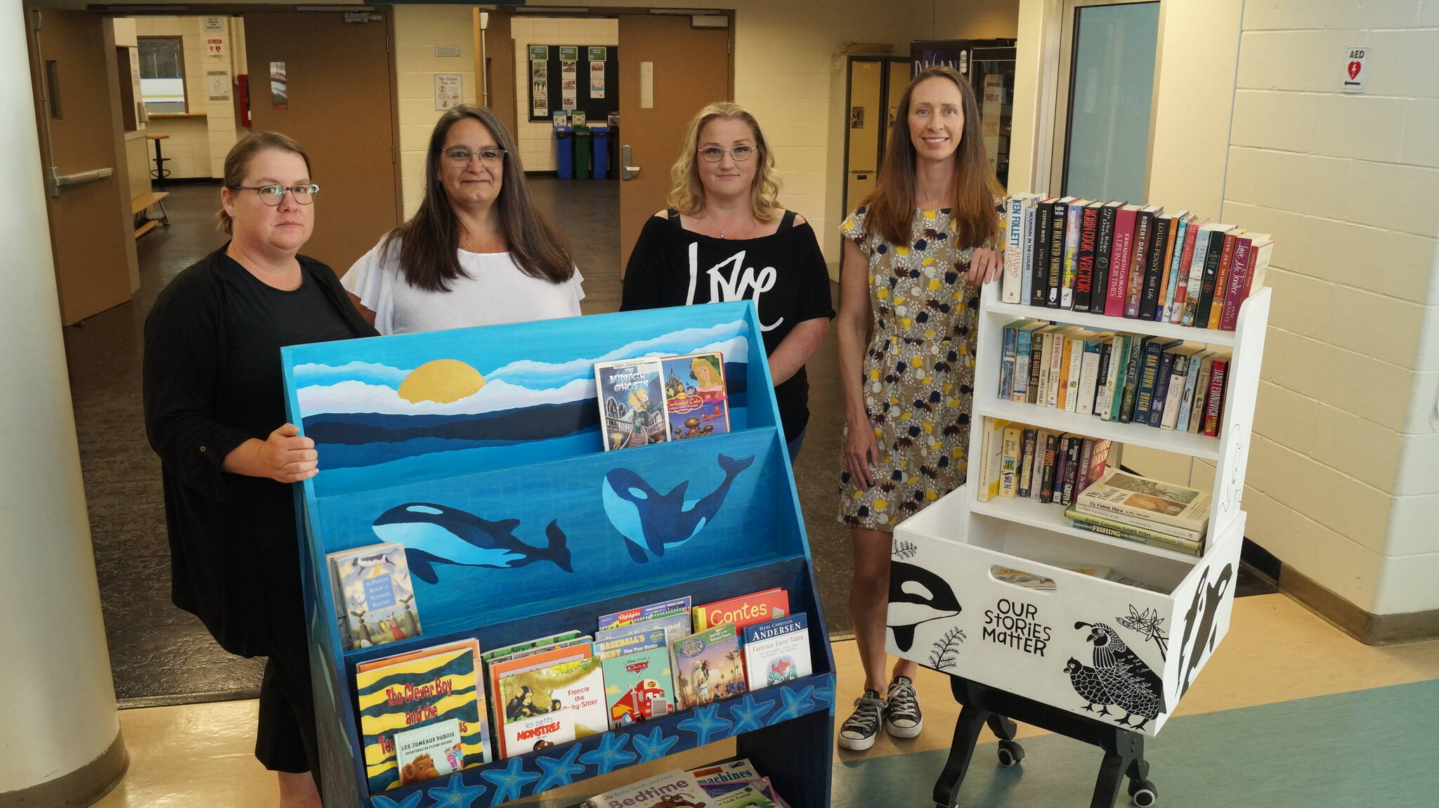 Sooke artists Anika Lacerte (left), Shelley Davies, Jill Warne, and Jeannine Sayler created the art work for the book bins at SEAPARC Leisure Complex as part of the Sooke Region Literary Project. 
(Rick Stiebel - Sooke News Mirror)