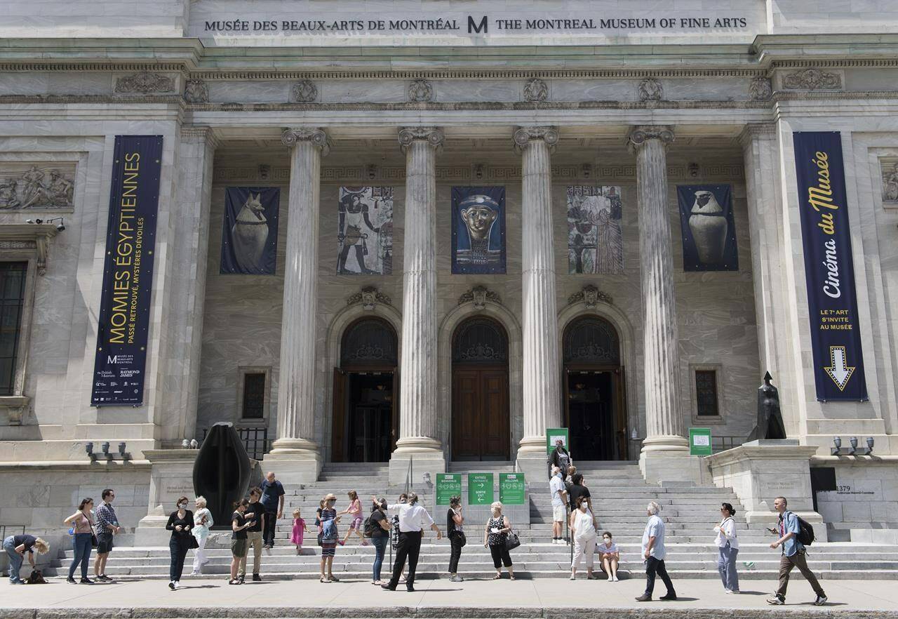 People wait to enter the Museum of Fine Arts in Montreal, Saturday, June 6, 2020. In the early morning hours of Sept. 4, 1972, three men rappelled from a skylight down a nylon rope into the second floor of the museum. Fifty years after what has been described as the biggest art heist in Canadian history, the thieves’ identity remains a mystery. THE CANADIAN PRESS/Graham Hughes