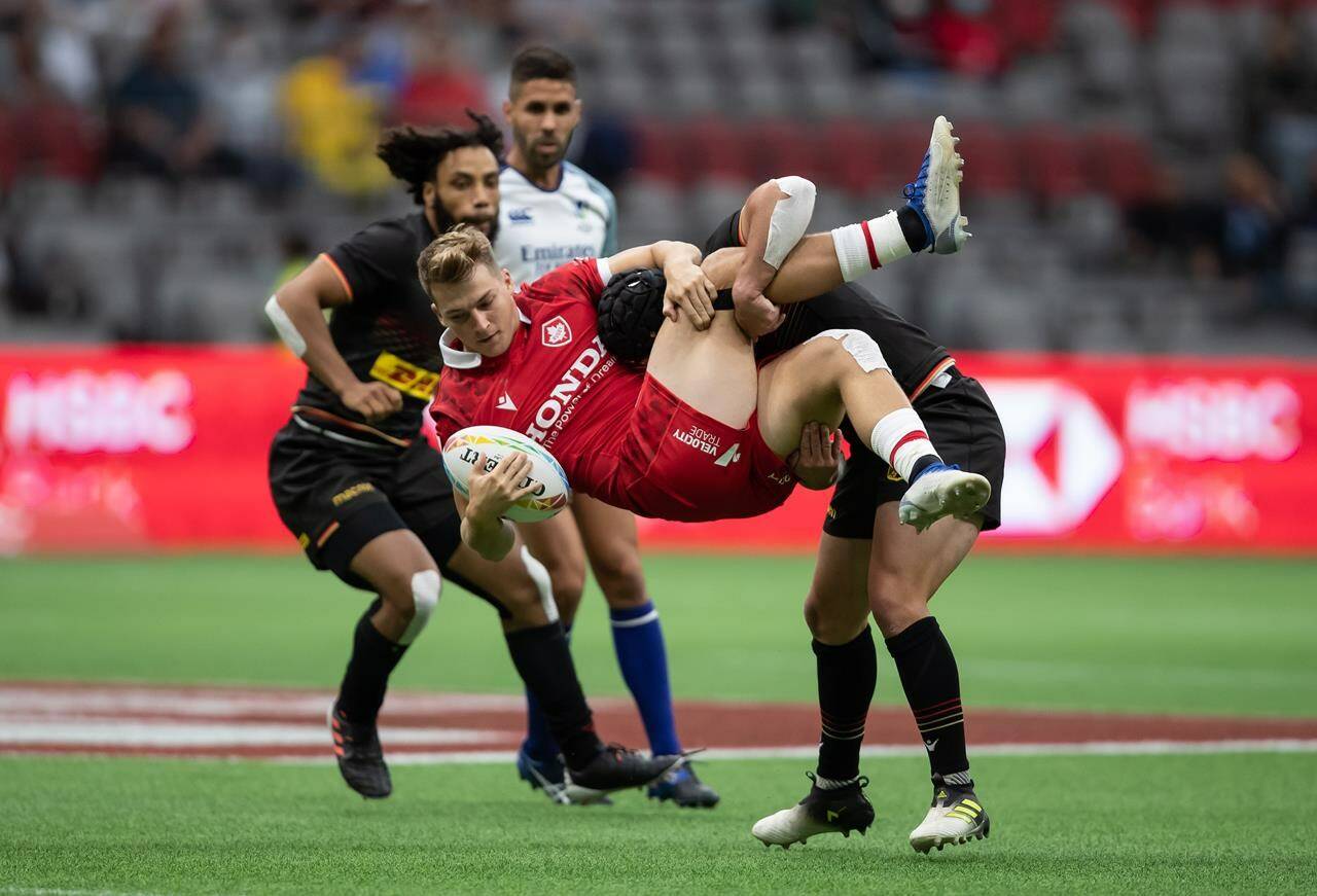 Canada’s Ciaran Breen, front, is tackled by Germany’s John Dawe during HSBC Canada Sevens rugby action, in Vancouver, B.C., Saturday, Sept. 18, 2021. THE CANADIAN PRESS/Darryl Dyck