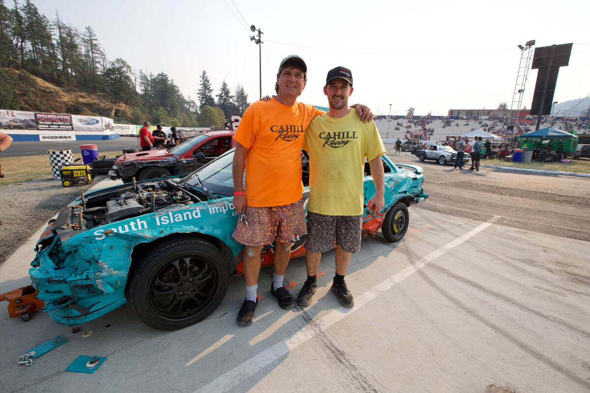 Celebrating the Western Speedway and Westshore Motorsports Park feature, page B1. <ins>Keith and Daryn Cahill stand for a photo in front of their car Saturday (Sept. 10) ahead of the Demo Championship at Westshore Motorsports Park in Langford. (Justin Samanski-Langille/News Staff)</ins>