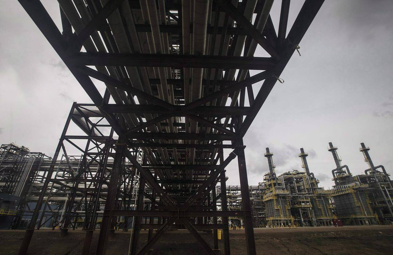 Pipes leading to a processing unit at Suncor Fort Hills facility in Fort McMurray, Alta., Monday, Sept. 10, 2018. Proponents of imposing a windfall tax on the Canadian oil and gas industry now have another global power setting precedent for the policy. THE CANADIAN PRESS/Jason Franson
