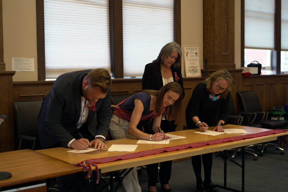 From left to right: Ryan Painter, Greater Victoria School District Board Chair, Caitlin Bird, Métis Nation Greater Victoria President, Lissa Dawn Smith, Métis Nation British Columbia President sign the agreement. (Courtesy of Greater Victoria School Board)