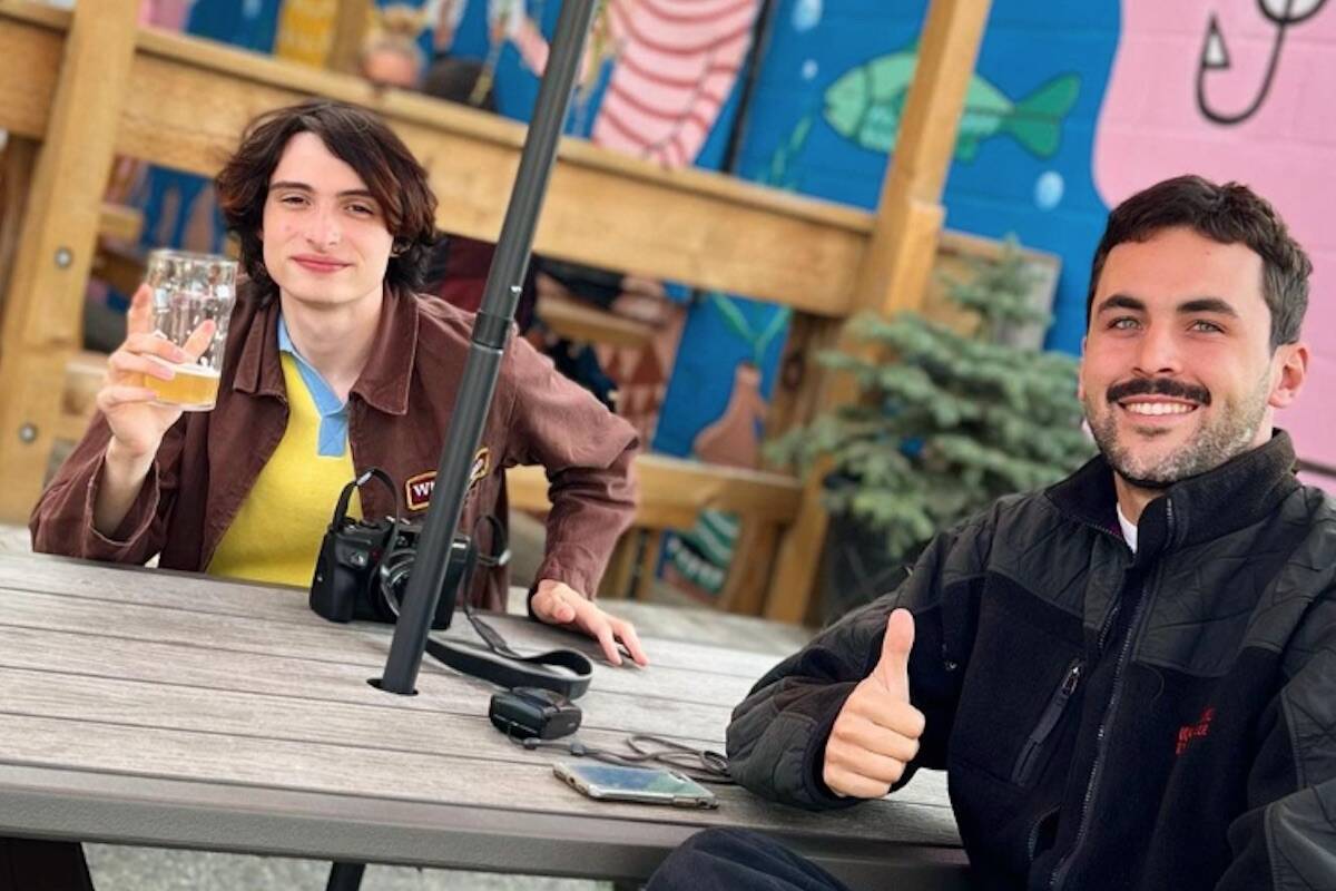 Stranger Things star Finn Wolfhard (left) at Kelowna’s Kettle River Brewing (Photo - @kettleriverbrew/Instagram)