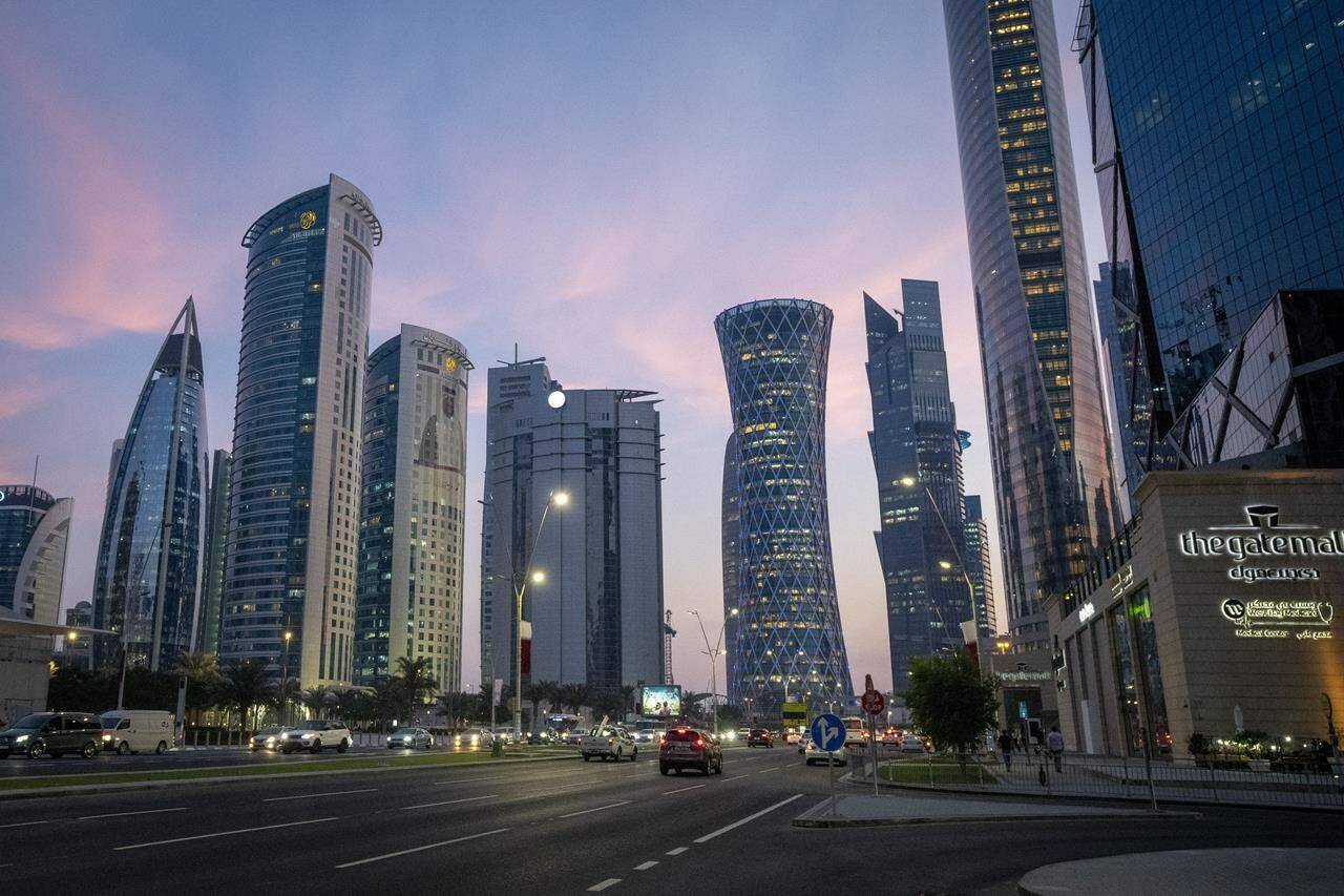 FILE — A view of hotels and other buildings at the West Bay area in Doha, Qatar, Thursday, Dec. 9, 2021. Many hotels in Qatar are already fully booked for the soccer World Cup which will be held in November and December 2022. Qatar’s ambassador to Germany was personally urged to abolish his country’s death penalty for homosexuality at a congress hosted by the German soccer federation on human rights in the World Cup host country. (AP Photo/Darko Bandic, file)