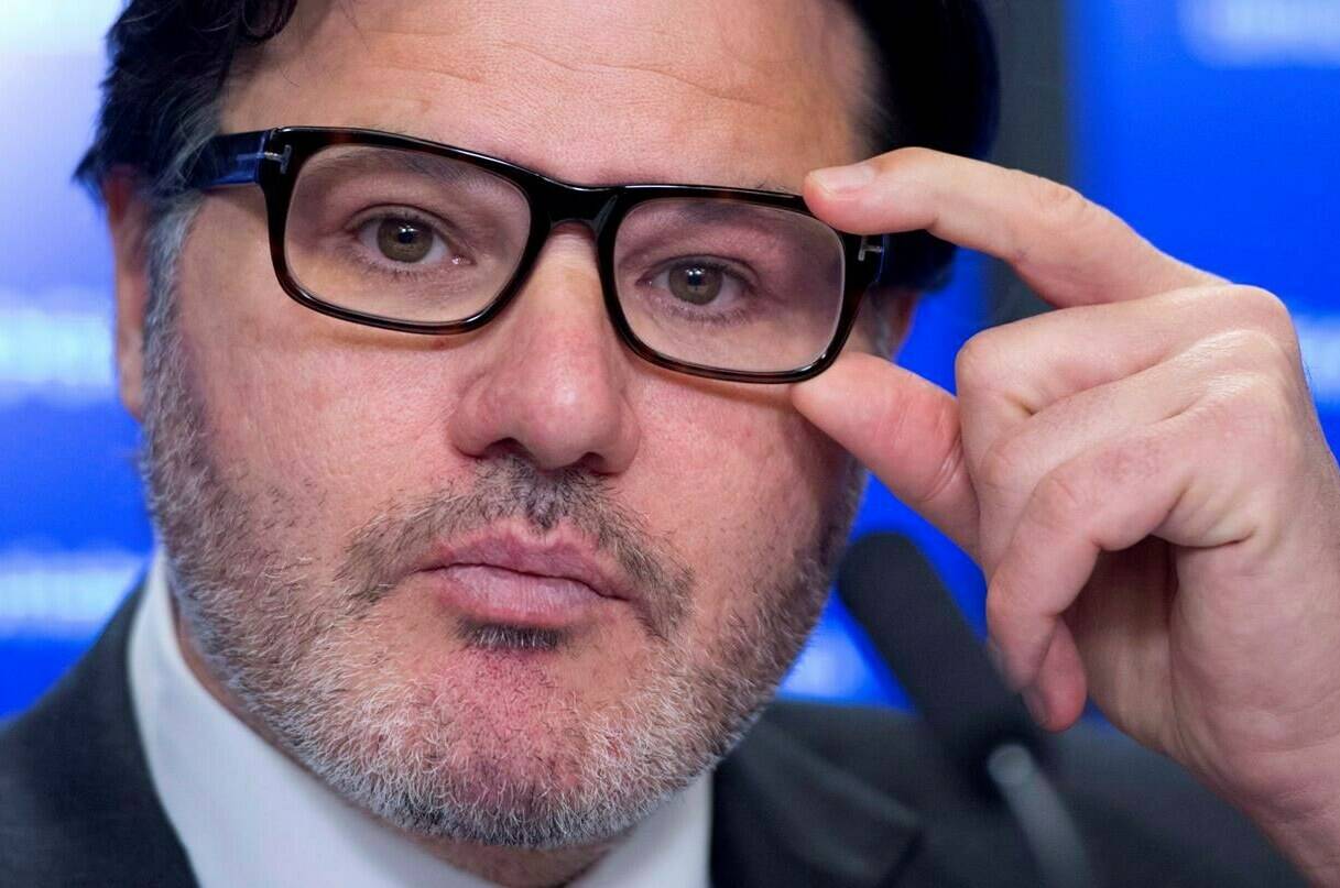 Vancouver Canucks owner Francesco Aquilini pauses for a moment during a press conference in Vancouver on Wednesday, April 9, 2014. THE CANADIAN PRESS/Jonathan Hayward