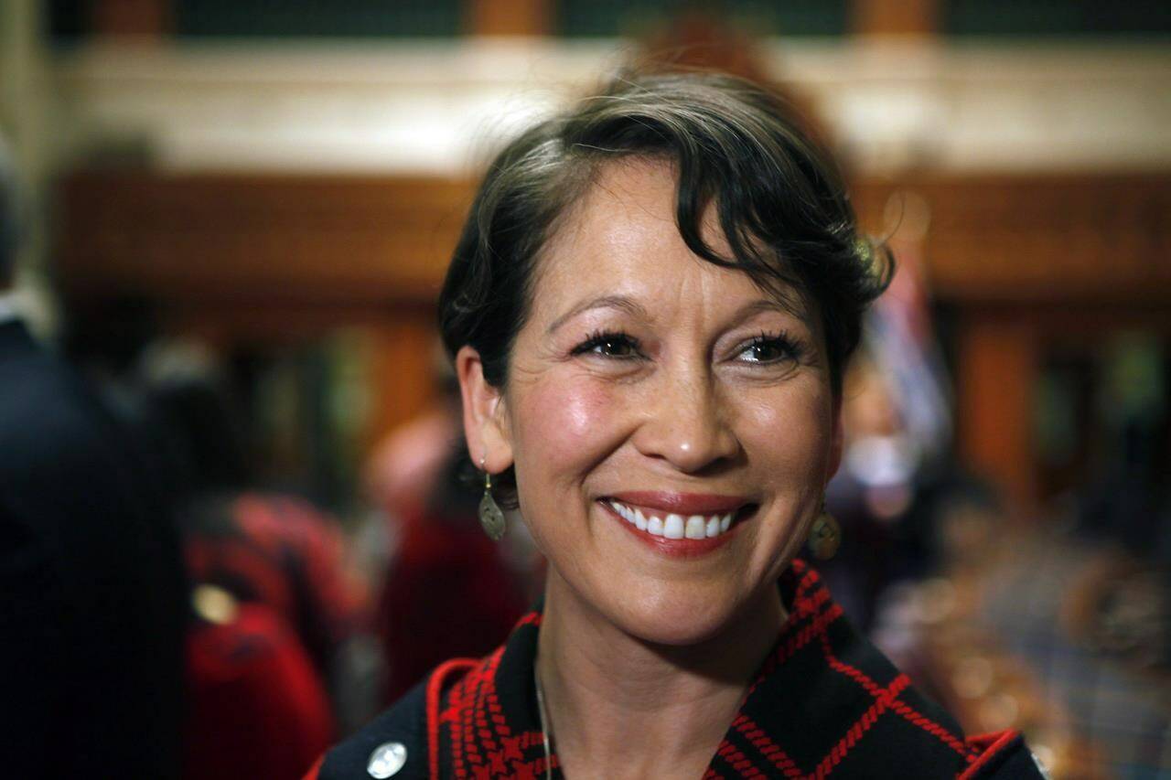 Melanie Mark speaks to the media after becoming the first First Nations woman to serve in the B.C. legislature, at a swearing-in ceremony on Wednesday, Feb. 17, 2016. Mark has resigned her ministerial portfolios to go on medical leave. THE CANADIAN PRESS/Chad Hipolito