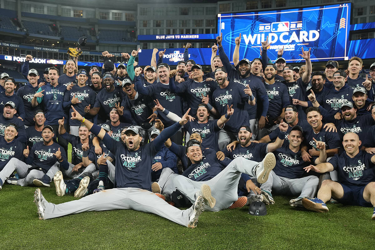 Seattle Mariners celebrate their win after American League wild card MLB baseball action against the Toronto Blue Jays in Toronto on Saturday, October 8, 2022. The Mariners came back from a seven-run deficit and beat Toronto 10-9 in a wild Game 2 on Saturday to eliminate the Blue Jays from the post-season. THE CANADIAN PRESS/Frank Gunn