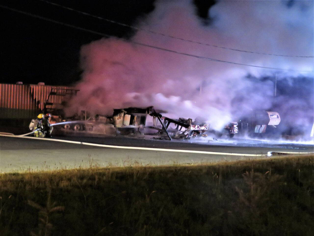 Fire crews with Port Alberni and Cherry Creek put out a fire at an RV park on Timberlane Road in Port Alberni. (PHOTO COURTESY JERRY FEVENS)