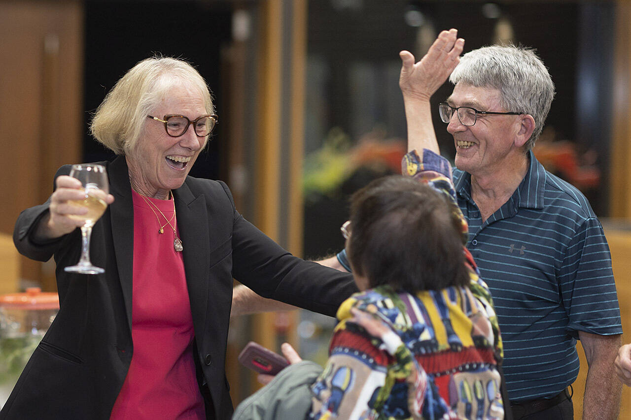 Barb Desjardins celebrates after discovering she defeated Sonya Gracey to win her fifth term as mayor of Esquimalt. (Arnold Lim/Black Press Media)