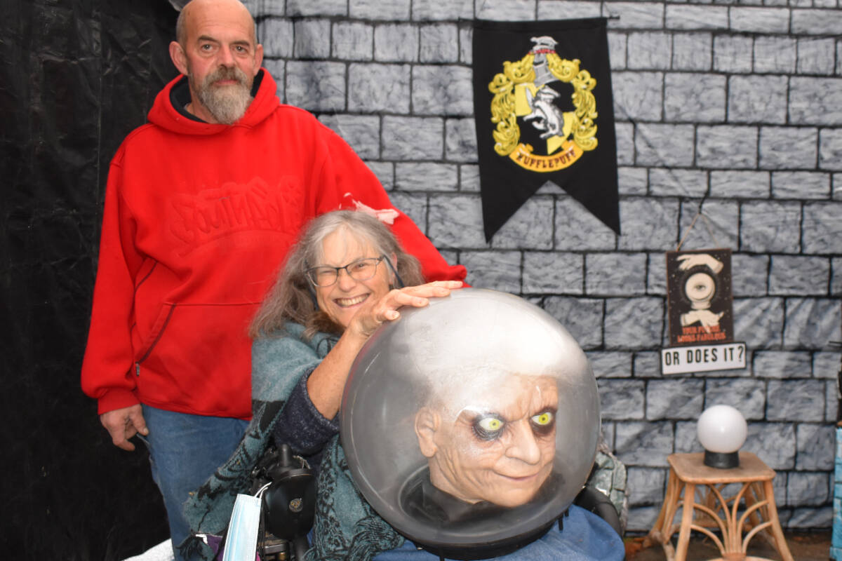 Bill Elliott and Kim Panter, here seen in the Harry Potter-themed room of Panter’s haunted house on Mills Road in Sidney, consider their creation a labour of love and a contribution to the community. (Wolf Depner/News Staff)