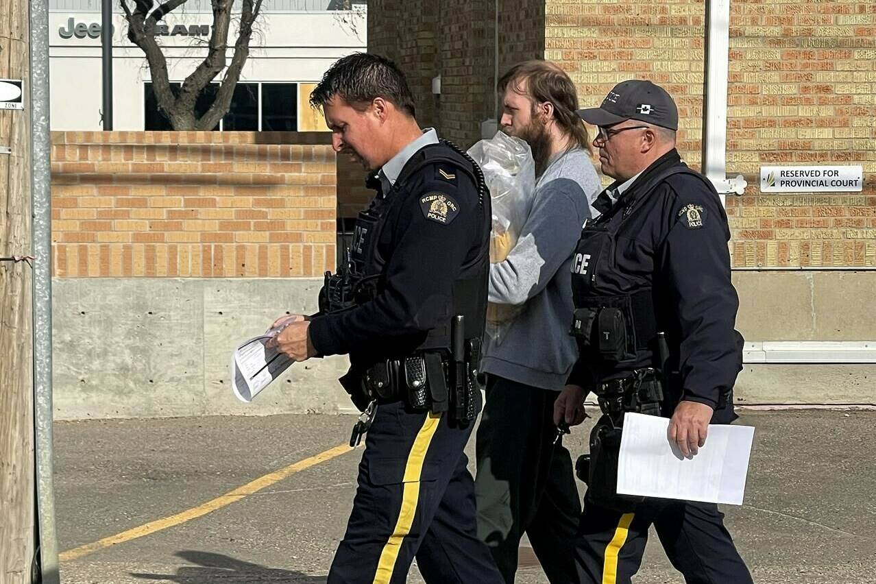 Travis Patron (centre) leaves the courthouse following his sentence at Court of King’s Bench in Estevan, Sask., Thursday, Oct. 20, 2022. THE CANADIAN PRESS/Mickey Djuric