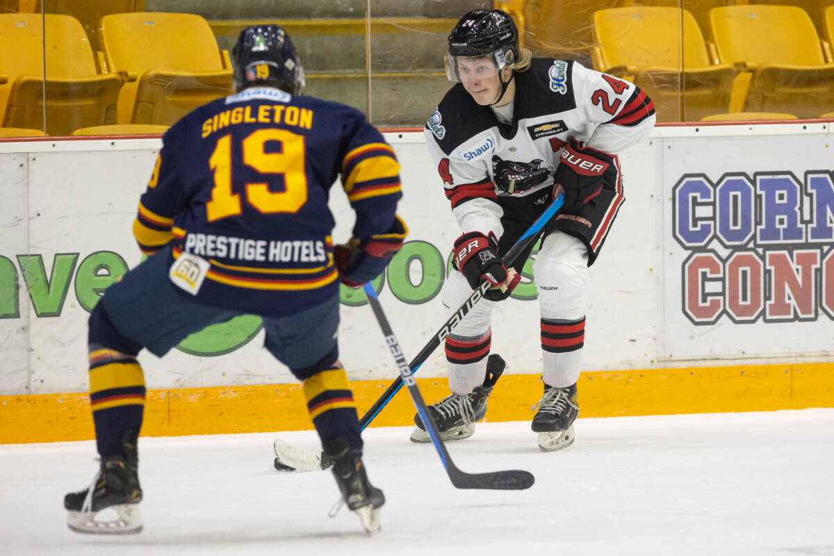 Alberni Valley Bulldogs forward AJ Vasko attempts to skate the puck around Vernon Vipers forward Bowden Singleton. (GARRETT JAMES PHOTOGRAPHY)