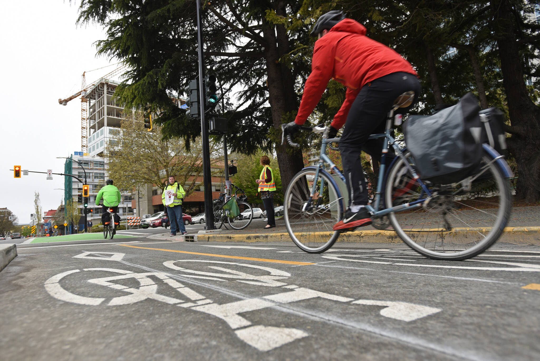 The City of Victoria is asking the public for their thoughts on its downtown bike valet project. A cyclist is pictured on the Pandora Avenue bike lanes. (Black Press Media file photo)