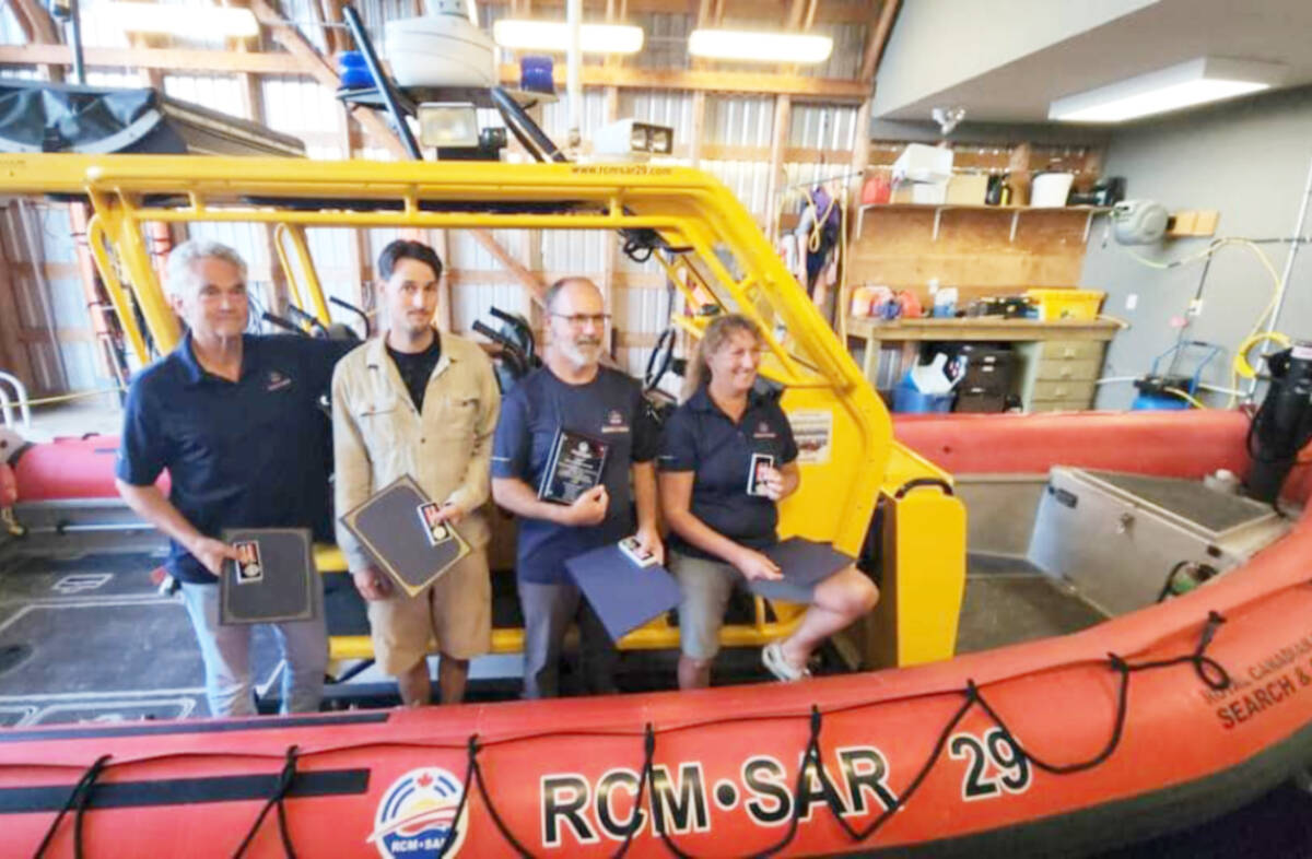 Ladysmith RCMSAR members cited for their rescue efforts a year ago of two men on a fishing boat, from left, include: Phil Kelsey, Ross Hayes, John Oakes and Susan Wisely. (Photo by RCMSAR Station 29 Ladysmith)