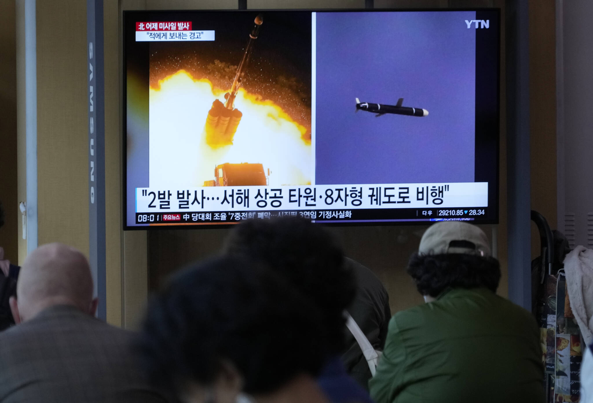 A TV screen shows file images of North Korea’s missile launch during a news program at the Seoul Railway Station in Seoul, South Korea, Oct. 13, 2022. (AP Photo/Ahn Young-joon)