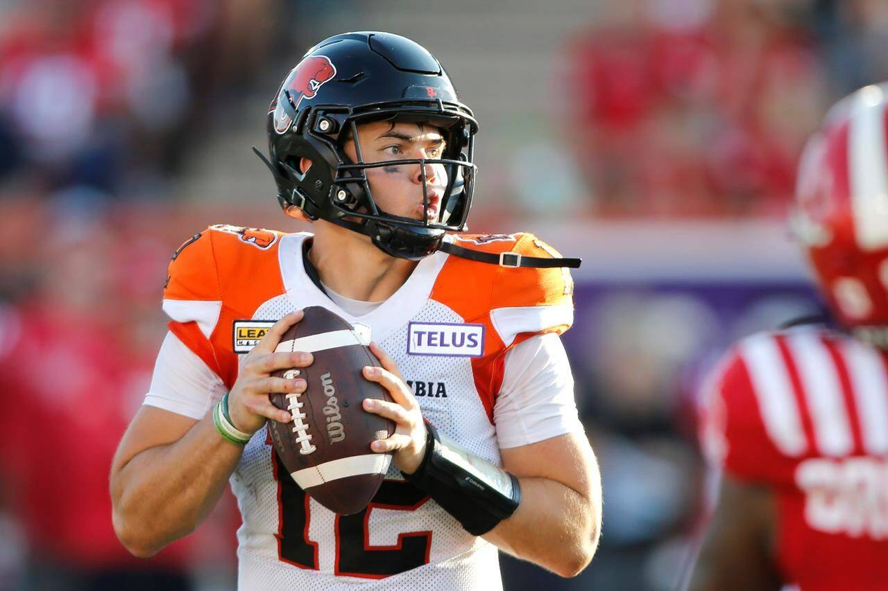B.C. Lions quarterback Nathan Rourke looks downfield during second half CFL football action against the Calgary Stampeders in Calgary, Saturday Aug. 13, 2022. THE CANADIAN PRESS/Larry MacDougal