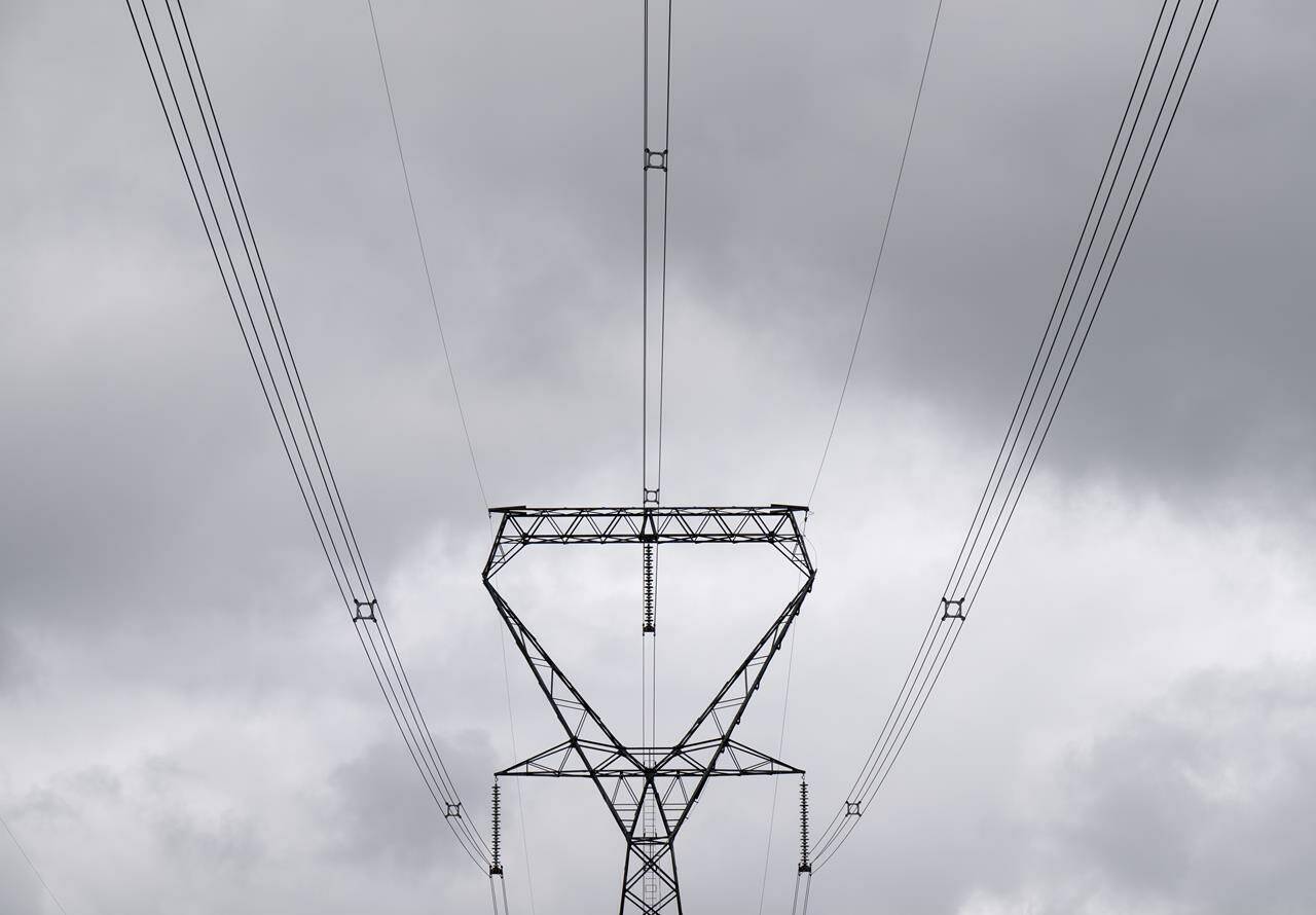 Power lines are seen against cloudy skies near Murvale, Ont. northwest of Kingston, Wednesday, Sept. 7, 2022. Power outages stretched into a second day for tens of thousands of BC Hydro customers, as crews continued to repair the damage caused by Friday’s fierce storms throughout British Columbia’s south coast.THE CANADIAN PRESS/Adrian Wyld