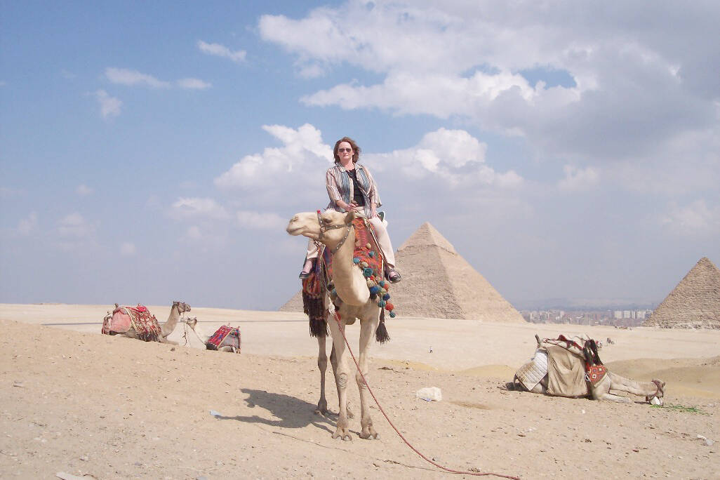 Monica Reekie rides a camel near the Egyptian pyramids. (Contributed - Monica Reekie)