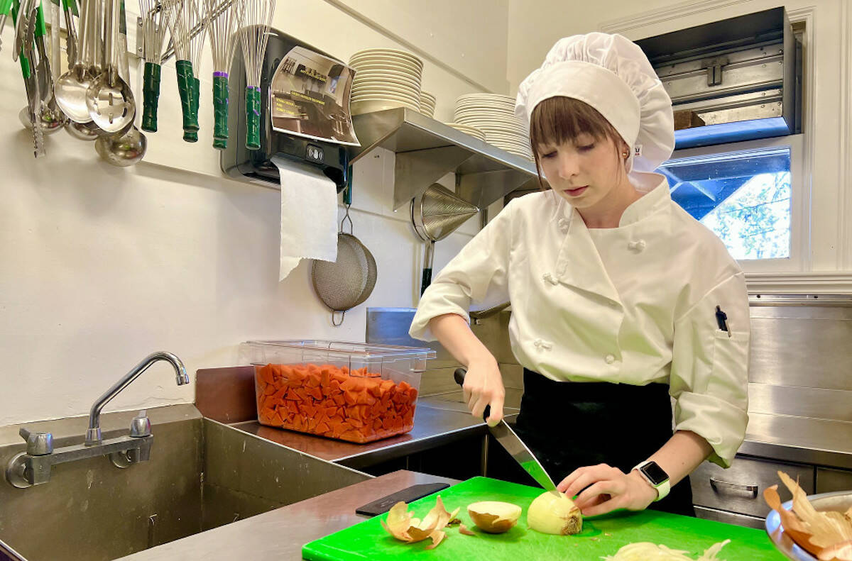 Camosun College hospitality management student Kaitlyn Simons prepares a meal. (Courtesy of Camosun College)