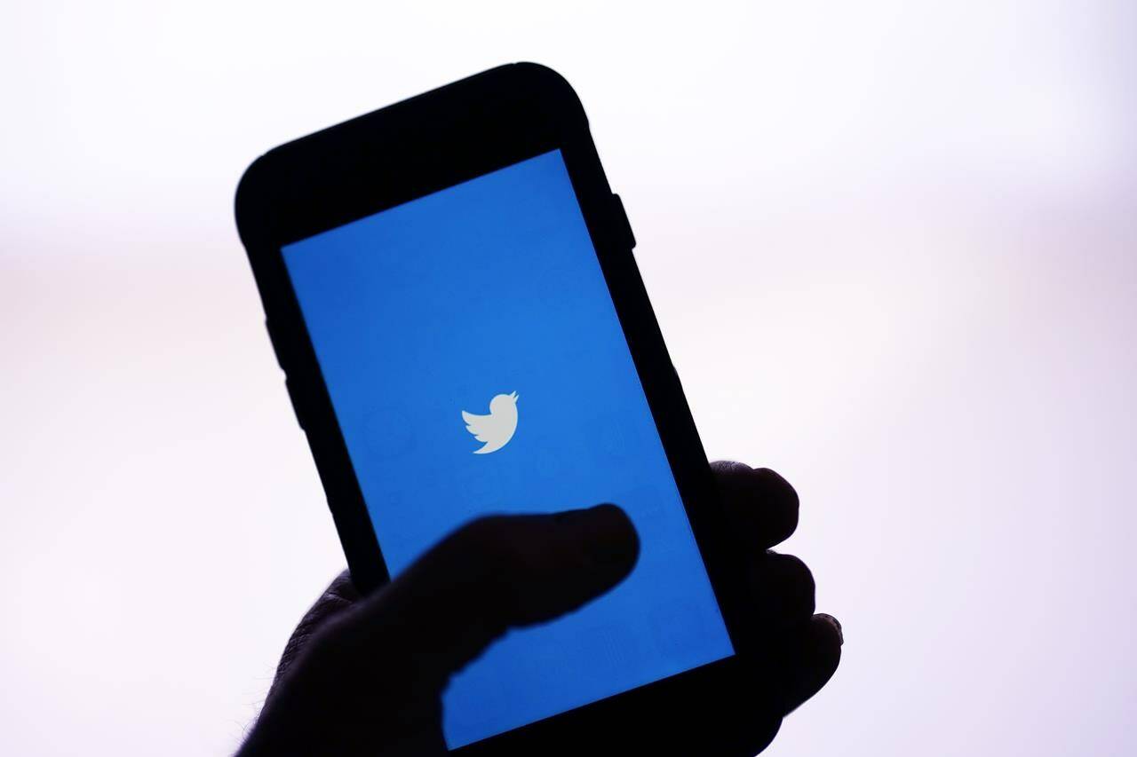 FILE - The Twitter application is seen on a digital device Monday, April 25, 2022, in San Diego. The number of posts on Twitter containing racial slurs has soared since Elon Musk purchased the influential platform, new research shows. Analysts at the Center for Countering Digital Hate searched for English-language posts containing one of several different racial slurs. They found that the use of all of them went up in the first full week after Musk bought Twitter. (AP Photo/Gregory Bull, File)