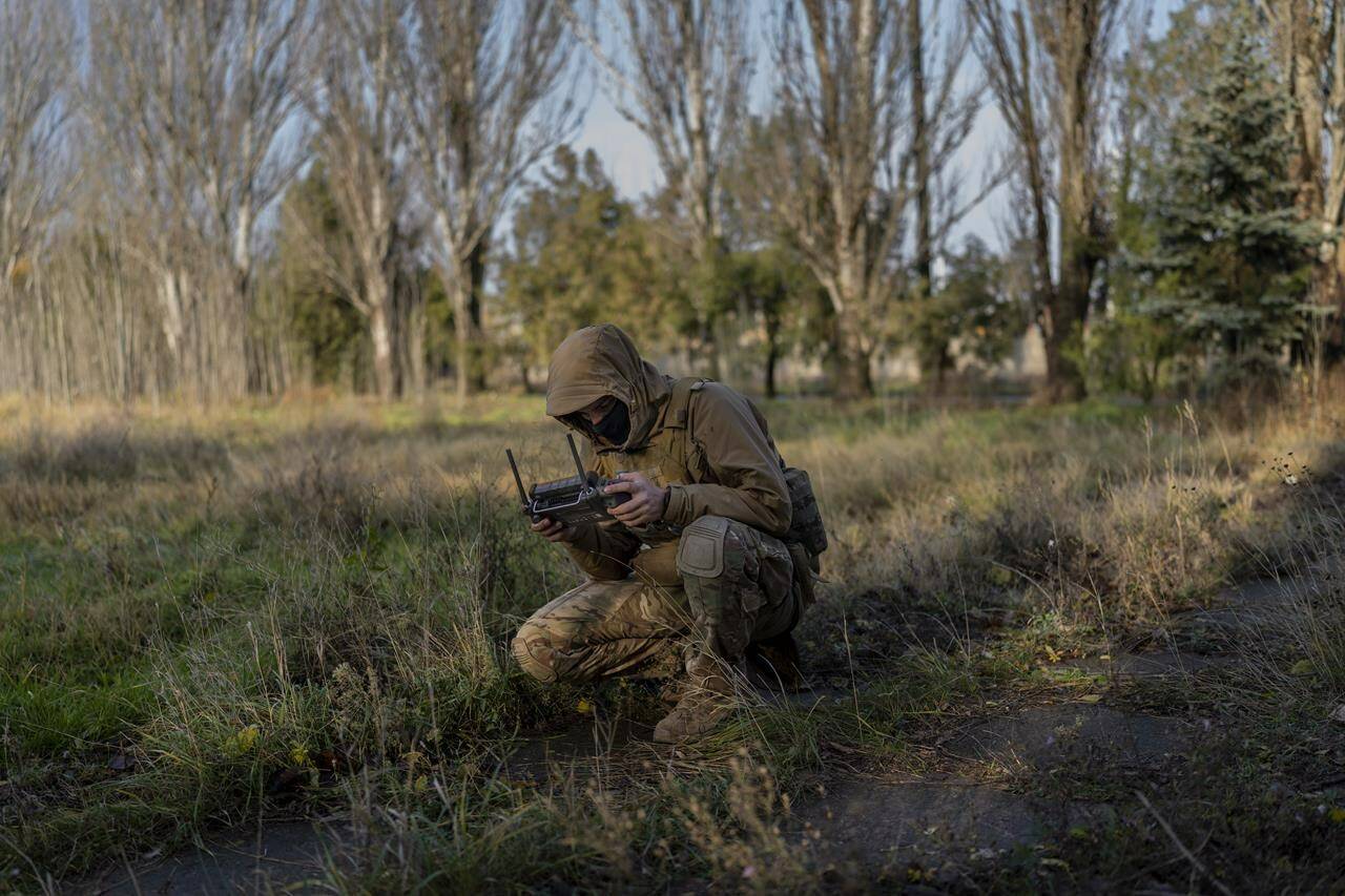 A Ukrainian serviceman flies a drone during an operation against Russian positions, Kherson region of southern Ukraine, Saturday, Nov. 19, 2022. (AP Photo/ Bernat Armangue)