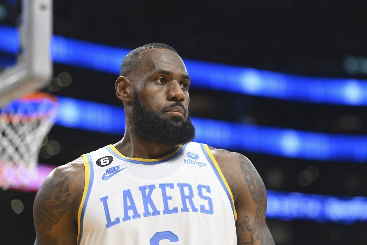 Los Angeles Lakers forward LeBron James looks on during an NBA basketball game against the Denver Nuggets, Oct. 30, 2022, in Los Angeles. Much like many of Twitter’s hundreds of millions of users, professional sports stars are also dealing with the chaos and uncertainty surrounding the microblogging app since Elon Musk took it over and began trimming the staff and making other changes. Even the people paid to advise the athletes are not necessarily sure how to proceed as Twitter evolves — or maybe goes away entirely. (AP Photo/Michael Owen Baker)