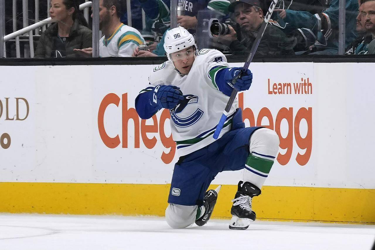 Vancouver Canucks left wing Andrei Kuzmenko celebrates after scoring during overtime in the team’s NHL hockey game against the San Jose Sharks on Sunday, Nov. 27, 2022, in San Jose, Calif. The Canucks won 4-3. (AP Photo/Tony Avelar)