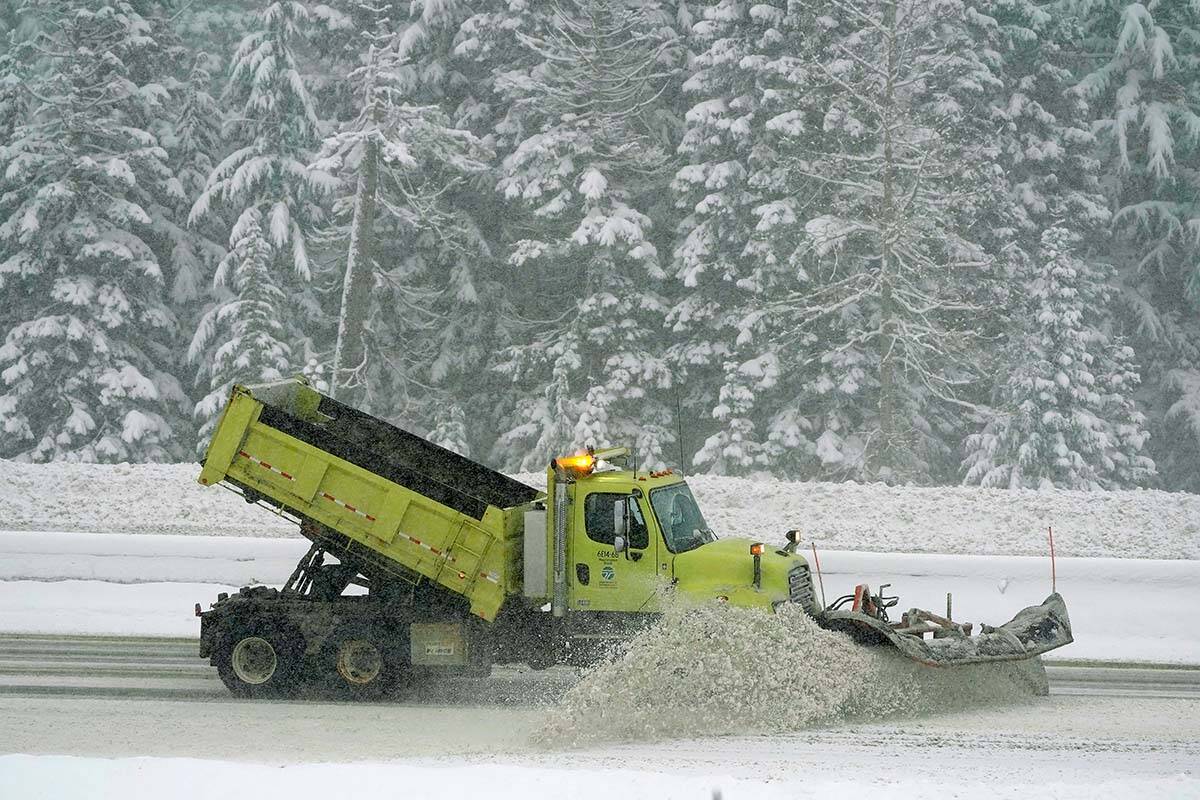 A snowplow works to shift snow off of a highway. Environment Canada is forecasting that much of southwestern B.C. could see snow on Nov. 29 and Nov. 30. (AP Photo/Ted S. Warren)