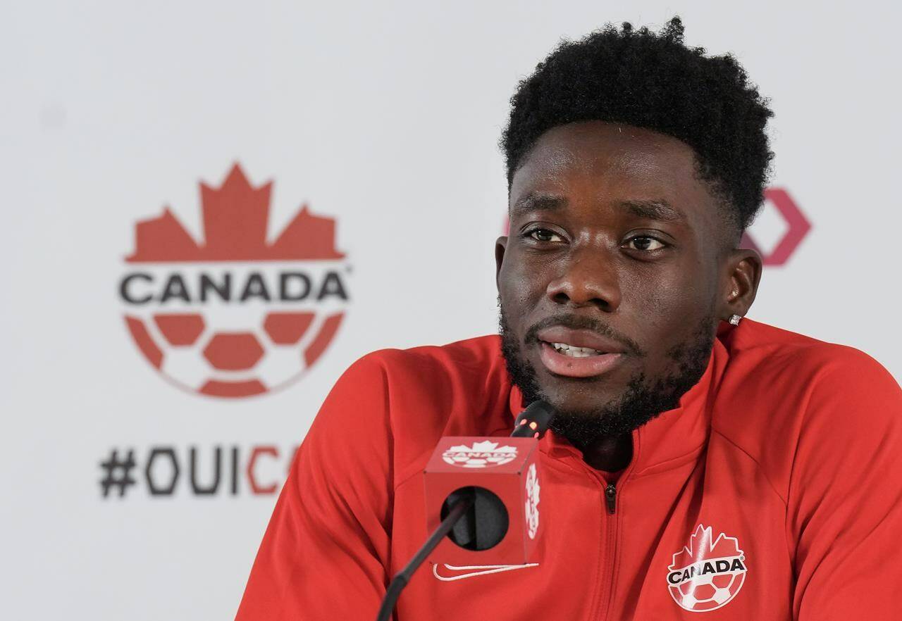Canada forward Alphonso Davies speaks to the media after practice at the World Cup in Doha, Qatar on Tuesday, November 29, 2022. THE CANADIAN PRESS/Nathan Denette