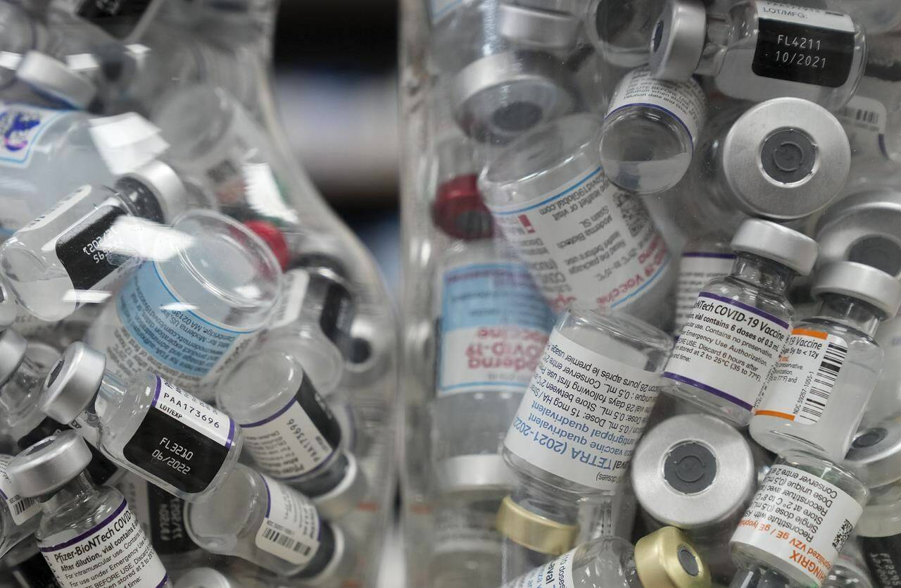 Jars full of empty COVID-19 vaccine vials are shown at the Junction Chemist pharmacy during the COVID-19 pandemic in Toronto on Wednesday, April 6, 2022. A large study that chronicles the trajectory of COVID-19 over the first 2-1/2 years of the pandemic shows most British Columbia children and adults under age 60 developed antibodies to slash the risk of severe illness either through vaccination, infection or both. THE CANADIAN PRESS/Nathan Denette