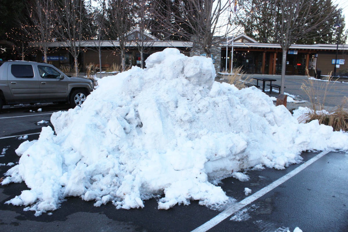 Huge pile of snow in the Waterwheel Park parking lot is an indication of how much snow fell in Chemainus at the end of November. (Photo by Don Bodger)