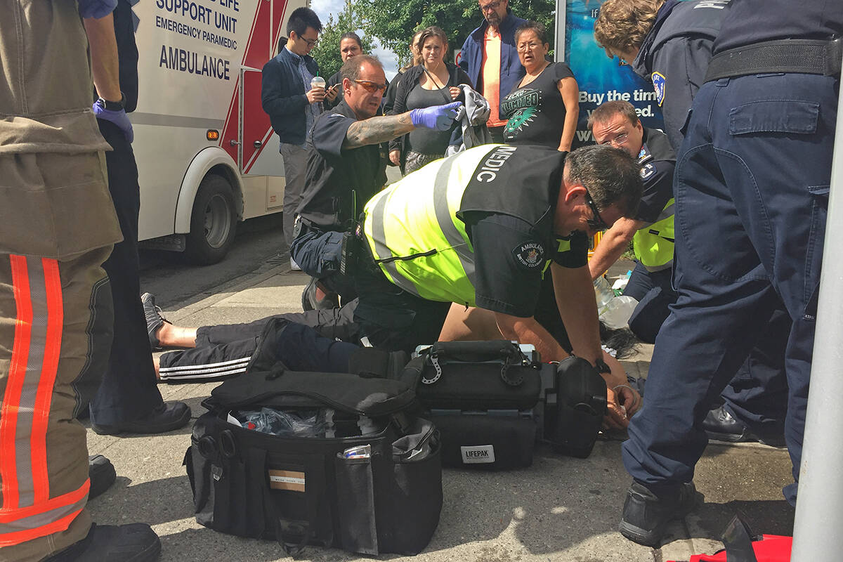 Paramedics work to revive a person from an apparent drug overdose in Chilliwack. (Black Press Media file photo)