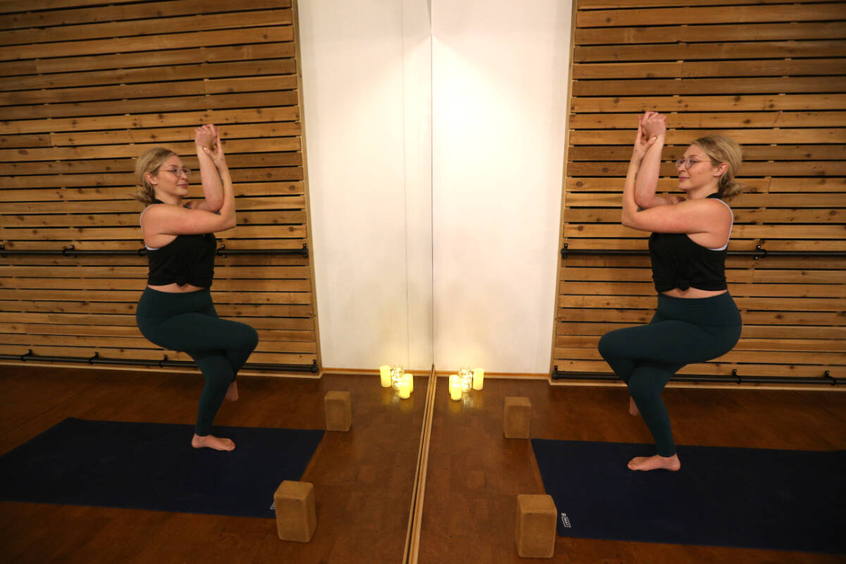 Kamila Nowak, director and instructor at The Lab Westshore yoga studio, practices some poses Thursday, Dec. 15. The studio expects a busy new year as people make new year’s resolutions, but UVic psychology professor Frederick Grouzet cautions people to ensure they are finding personal motivation for a resolution, rather than an external motivation, if they want to succeed. (Justin Samanski-Langille/News Staff)