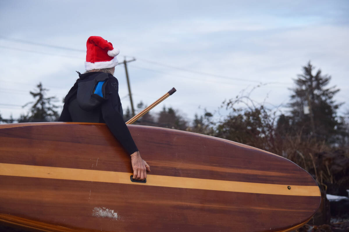 The Santa Surf, an annual event on Stories Beach in Campbell River, features paddleboarders getting their best wet suits on and their santa costumes in a coastal Yuletide affair. Photo Edward Hitchins/Campbell River Mirror