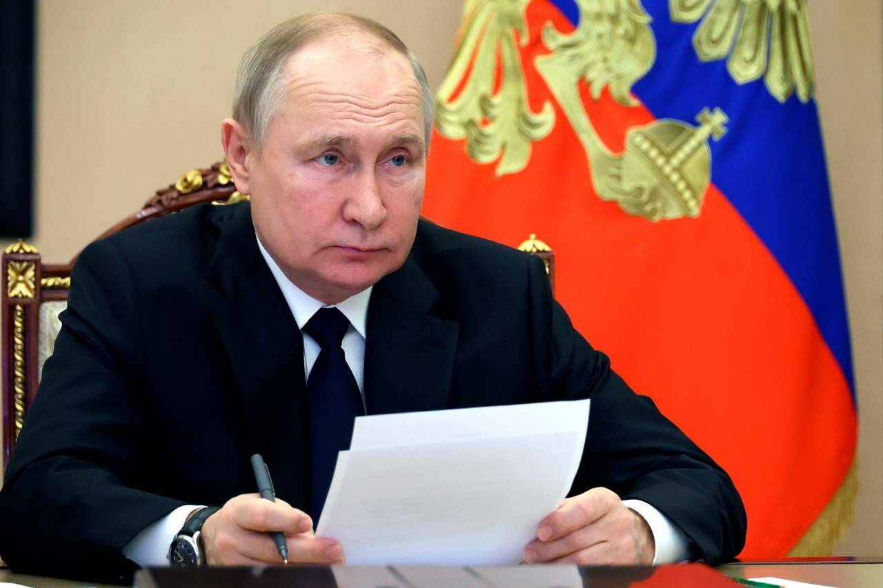 Russian President Vladimir Putin takes part in the launch ceremony of The Kovykta gas condensate field via videoconference in Moscow, Russia, Wednesday, Dec. 21, 2022. (Mikhail Kuravlev/Pool Photo via AP)